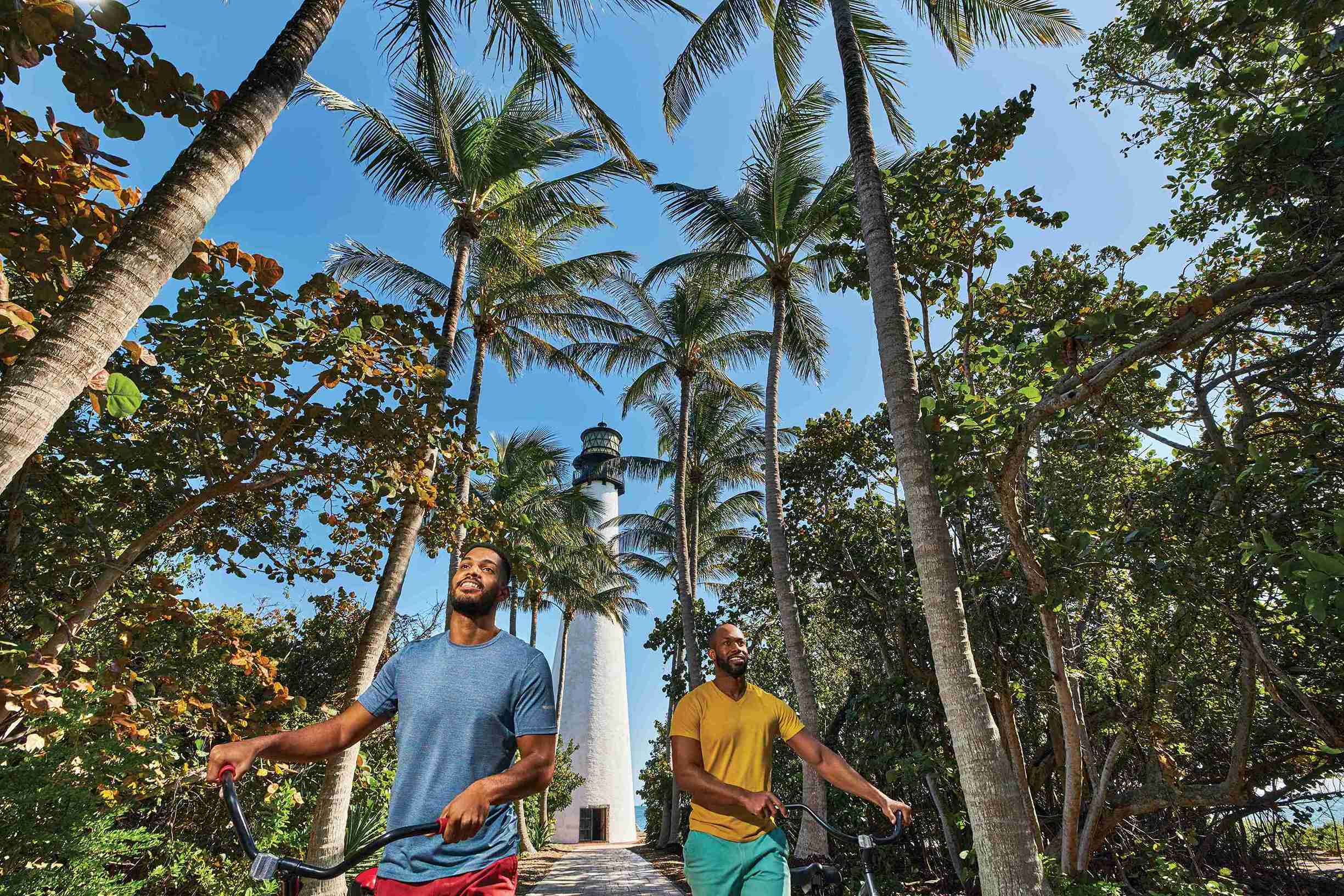 Men on Bikes Near Lighthouse - Bill Baggs Cape Florida State Park - Key Biscayne (Courtesy GMCVB)